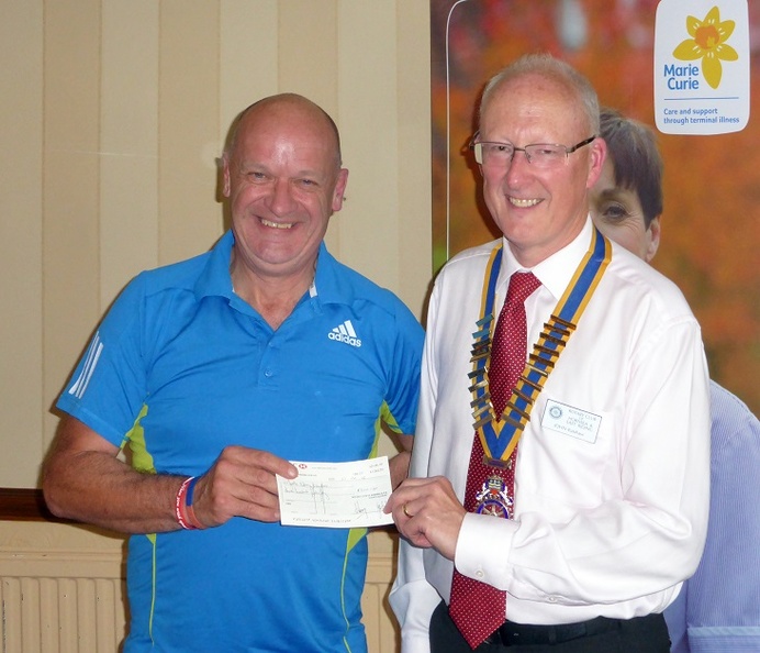 Steve Dixon receiving cheque from John Balshaw